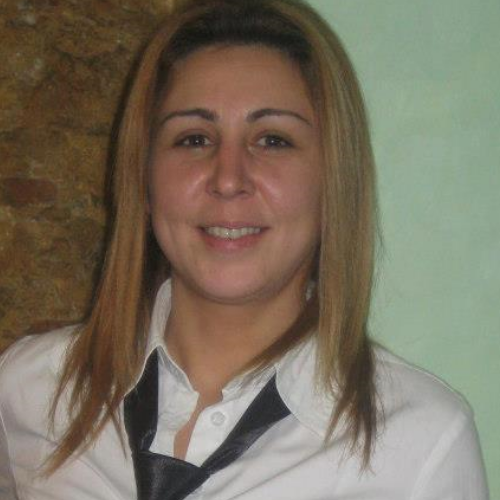 Business woman in an office. Crossed arms